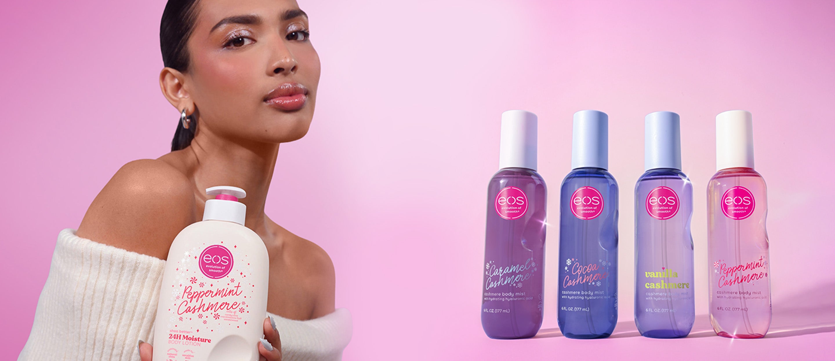 Woman holding a bottle of skincare product with multiple bottles displayed on a pink background